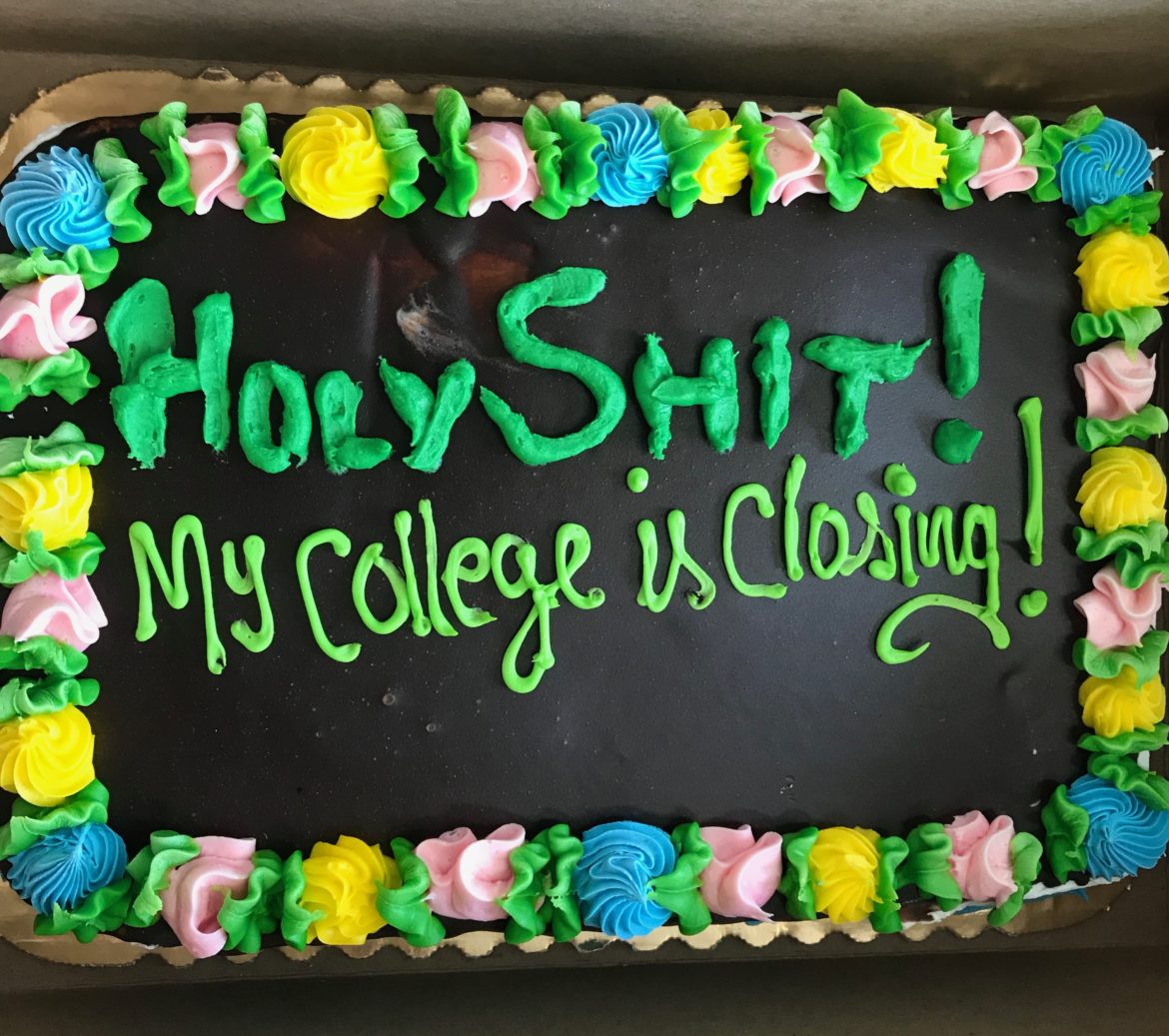 A cake that reads, "Holy shit! My college is closing!"