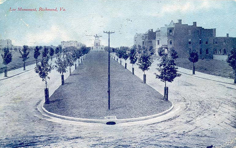 Postcard of Monument Avenue, centered on a tree-lined median with Lee Monument in the distance.